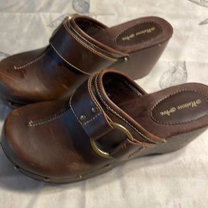 Brown with buckle man made material.